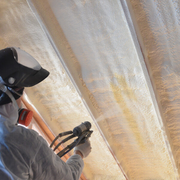 Polyurea Spraying, warming foam coating of roof a man spraying warming foam